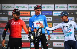 SAN BENEDETTO DEL TRONTO ITALY MARCH 16 LR Filippo Ganna of Italy and Team INEOS Grenadiers on second place overall race winner Juan Ayuso Pesquera of Spain and UAE Team Emirates XRG Blue Leader Jersey and Antonio Tiberi of Italy and Team Bahrain Victorious on third place pose on the podium ceremony after the 60th TirrenoAdriatico 2025 Stage 8 a 147km stage from Porto Potenza Picena to San Benedetto del Tronto UCIWT on March 16 2025 in San Benedetto del Tronto Italy Photo by Tim de WaeleGetty Images