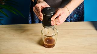 Coffee being extracted through the Wacaco Picopresso