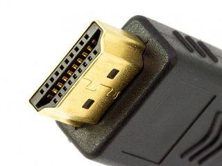 A close up image of an HDMI cable with a gold-plated connector
