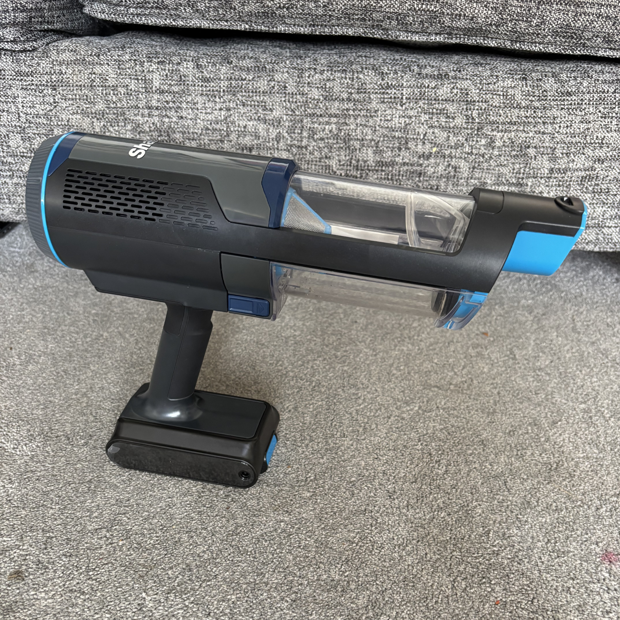 Shark PowerBoost Pet Cordless 2-in-1 Vacuum positioned on carpet