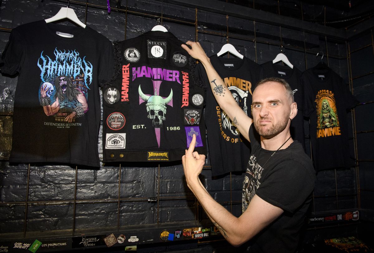 People drinking, smiling and throwing horns at the Metal Hammer 400 party