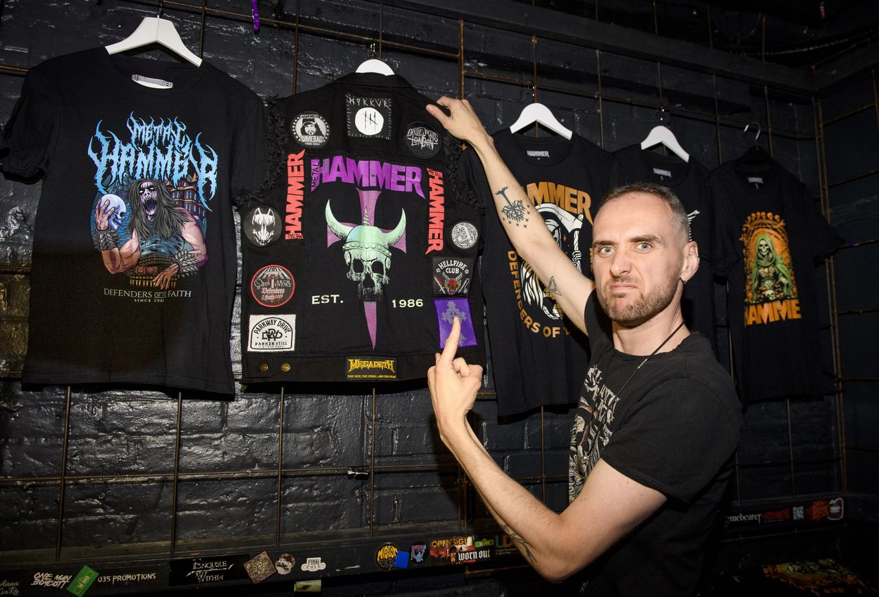 People drinking, smiling and throwing horns at the Metal Hammer 400 party