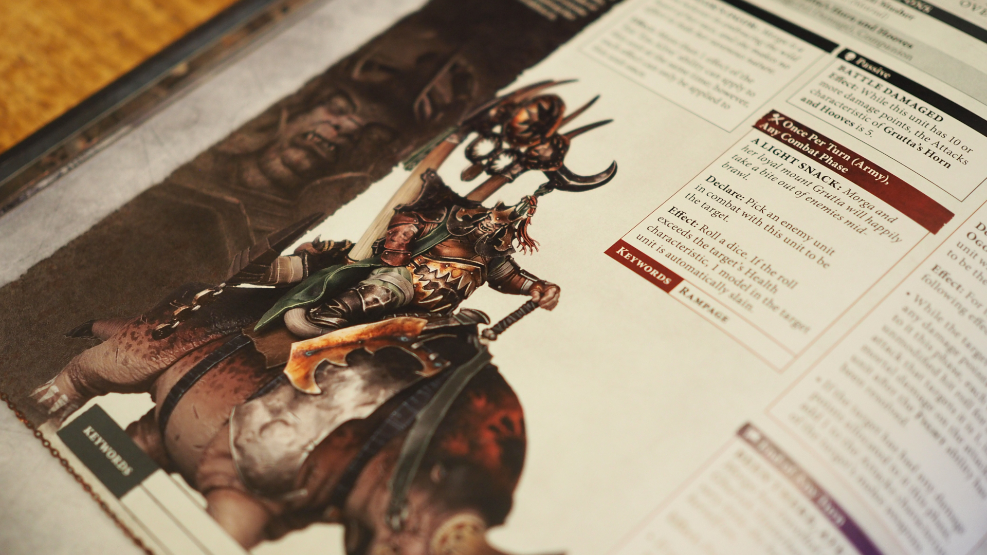 A page of the Ogor Mawtribes Battletome, showing a warrior atop a strange monster