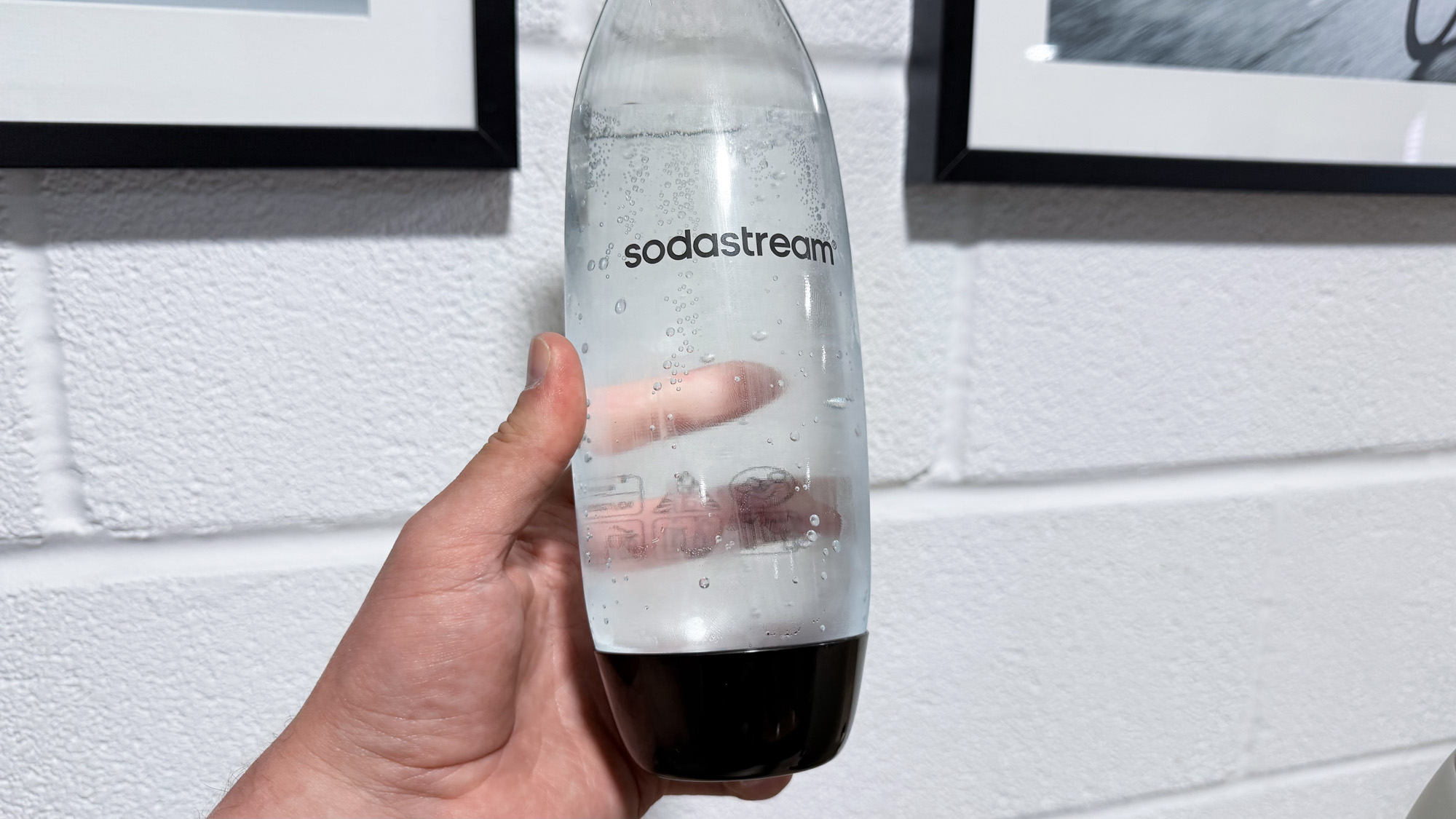 A sodastream bottle in hand