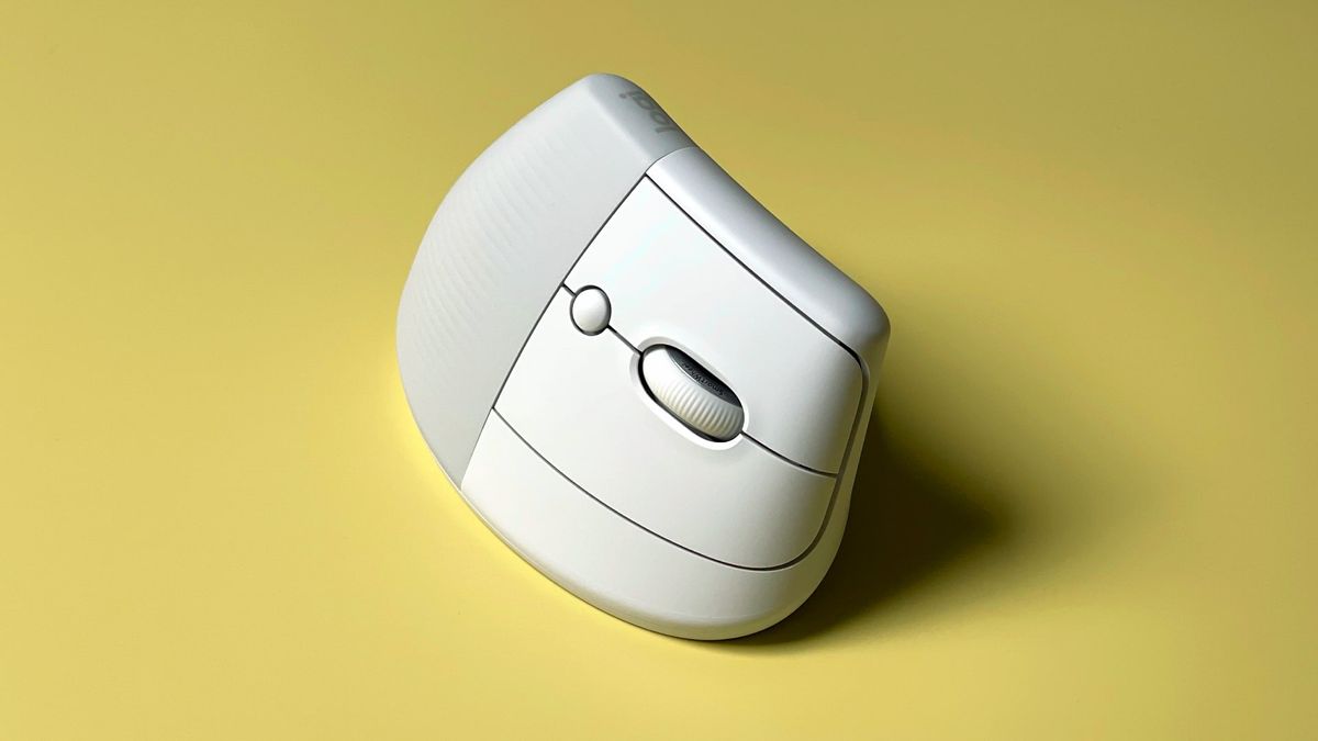 The Logitech Lift for Mac mouse against a yellow background.