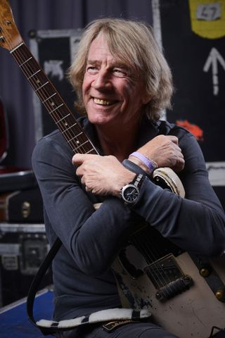 Rick Parfitt cradling a telecaster