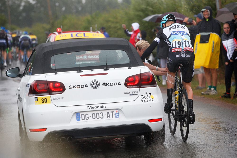Julien Vermote of Belgium and Etixx-QuickStep receives medical treatment following a crash during stage 5