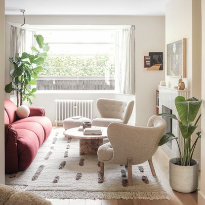 Living room with sofa, coffee table, armchairs