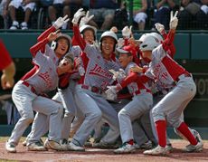 Tokyo's Little League baseball team celebrates a victory in Williamsport, Pennsylvania.