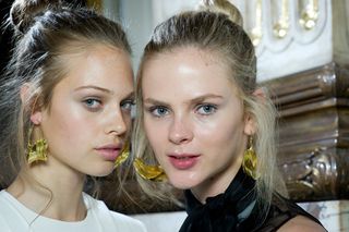 Two female models wearing light make-up