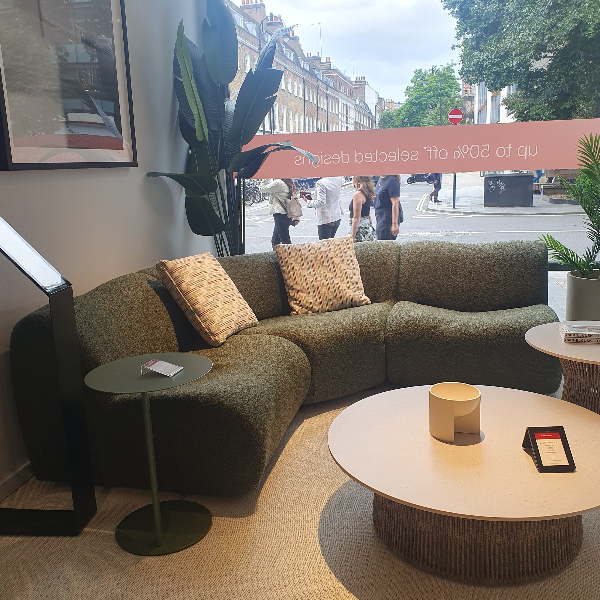 The King Living 1977 outdoor sofa in green at the brand's London showroom