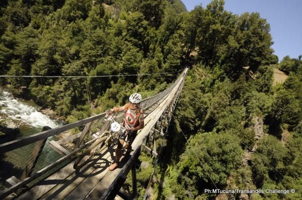 A Russian racer crosses the suspension bridge during stage 5 of the Trans Andes