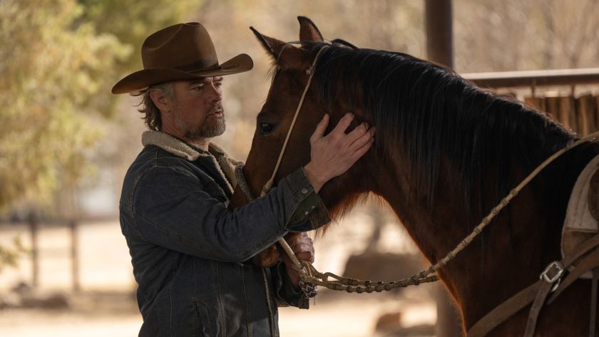 Staten stroking a horse in Ransom Canyon.