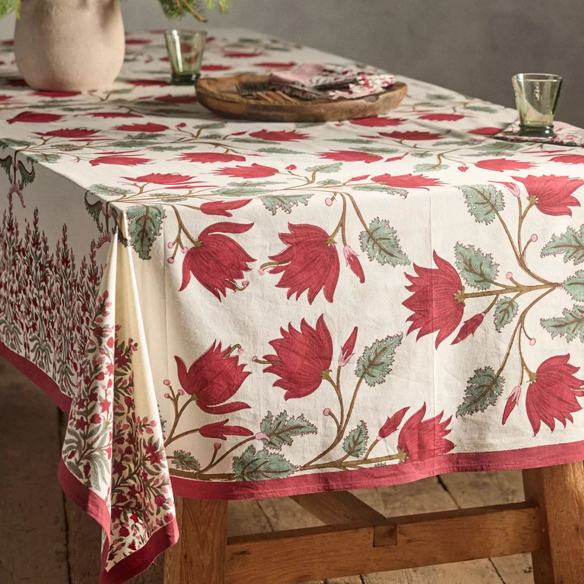 Red and white floral tablecloth with red border