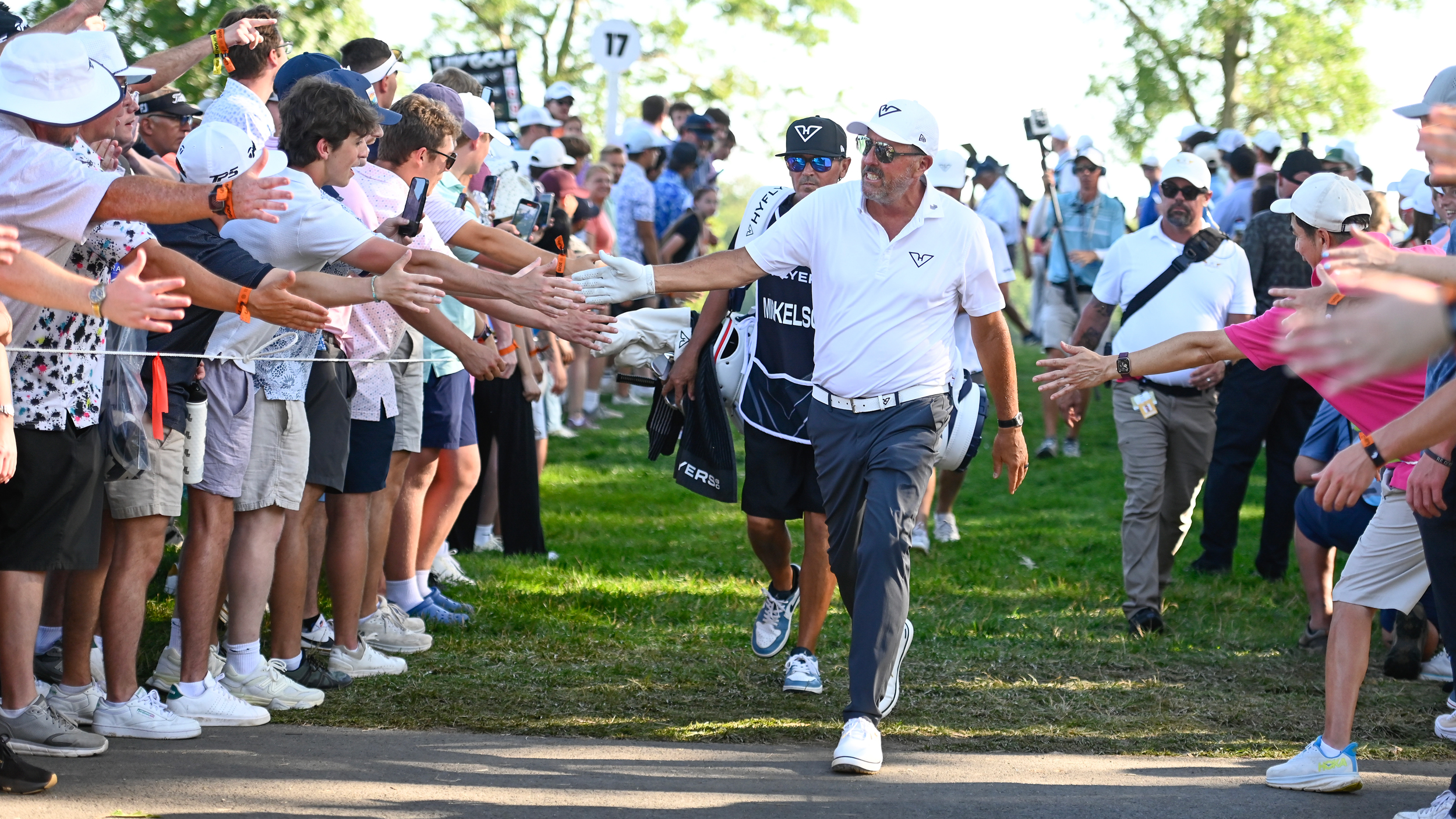 Phil Mickelson high-fives fans during LIV Golf Virginia 2025