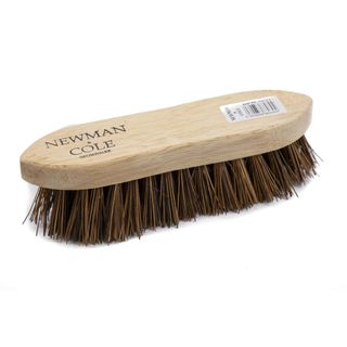 Wooden Scrubbing Brush with Newman and Cole written on the top on a white background