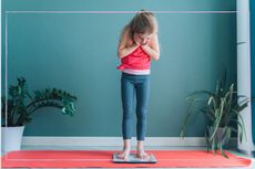 Child standing on a set of scales 