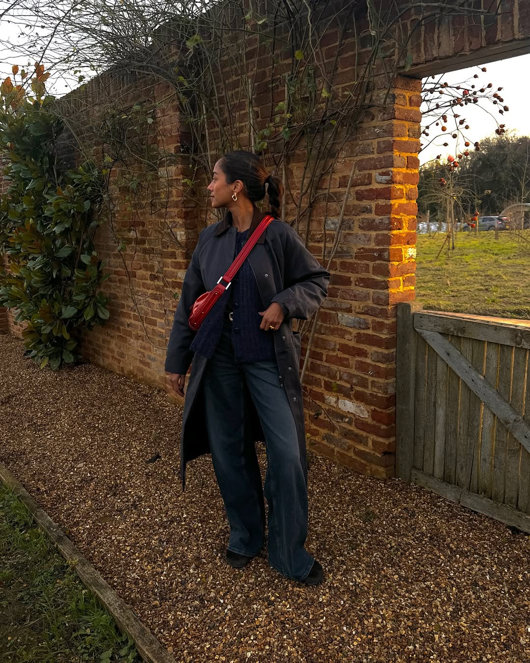 Trishna wearing red bag