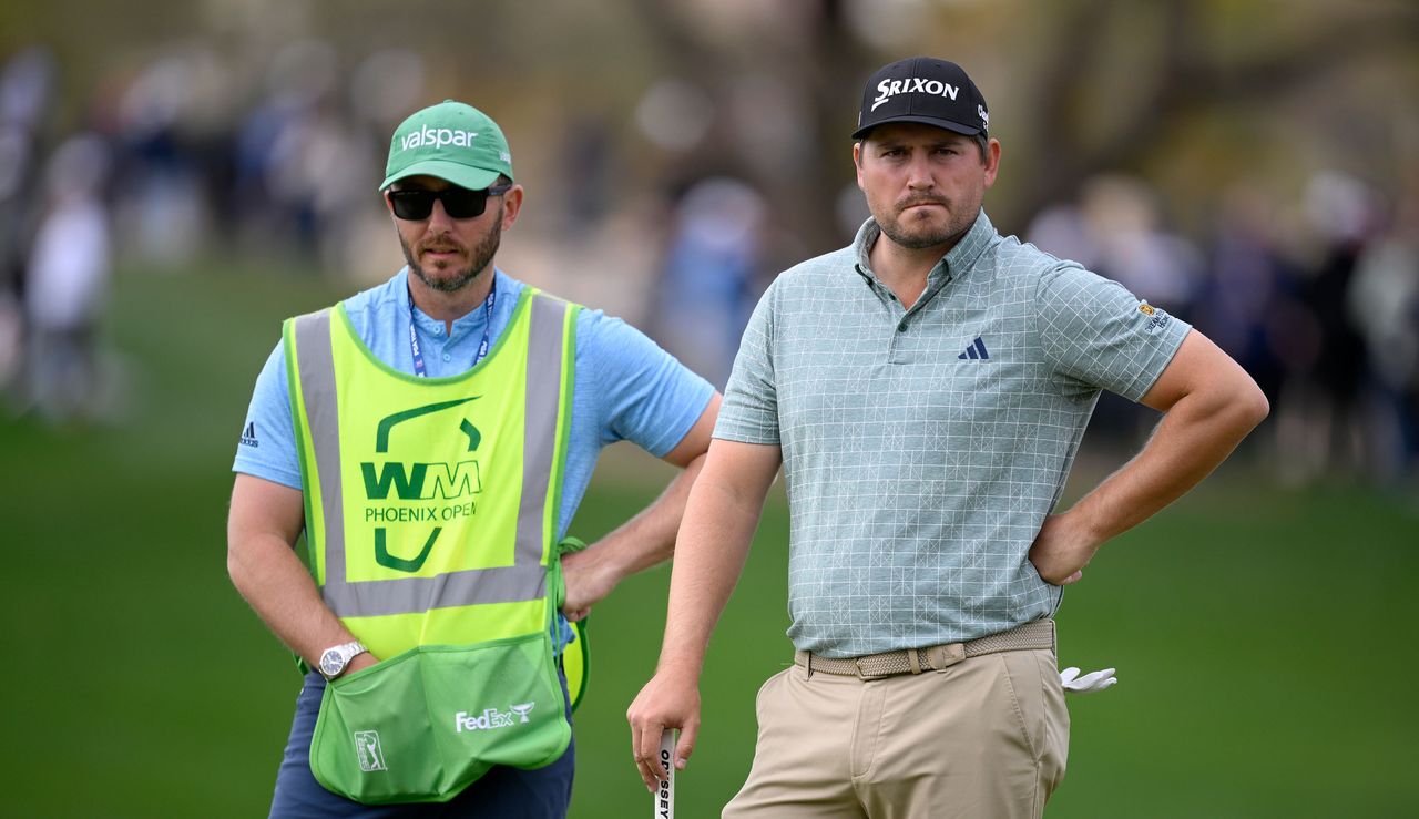 Andrew Novak stands alongside his caddie