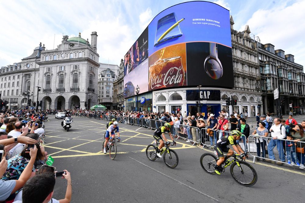 The riders pass the lights of Piccadilly Circus