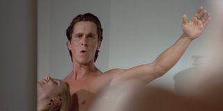 American Psycho Christian Bale as Patrick Bateman looking at himself in the mirror