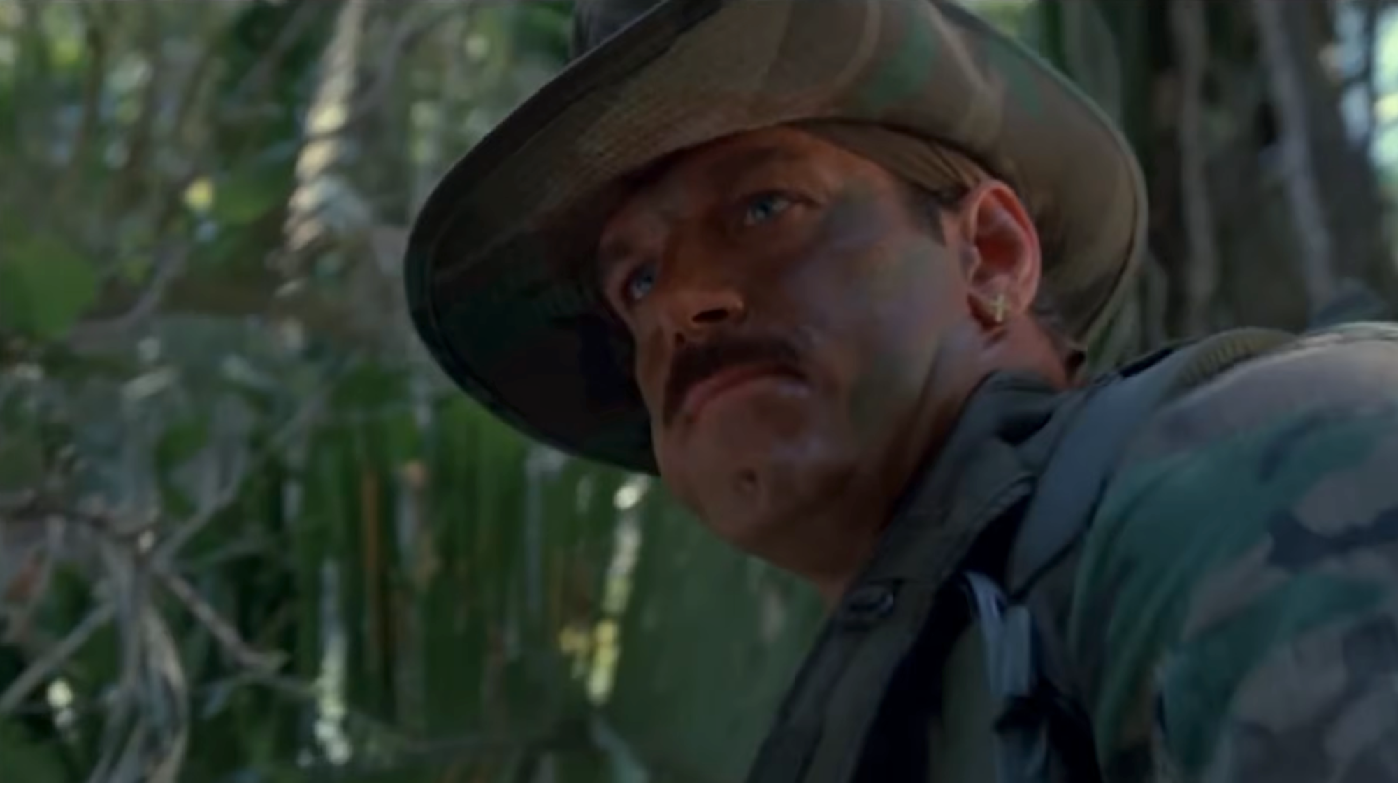 A close up of Jesse Ventura in army fatigues in Predator