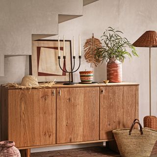 Wooden sideboard with curated display on top