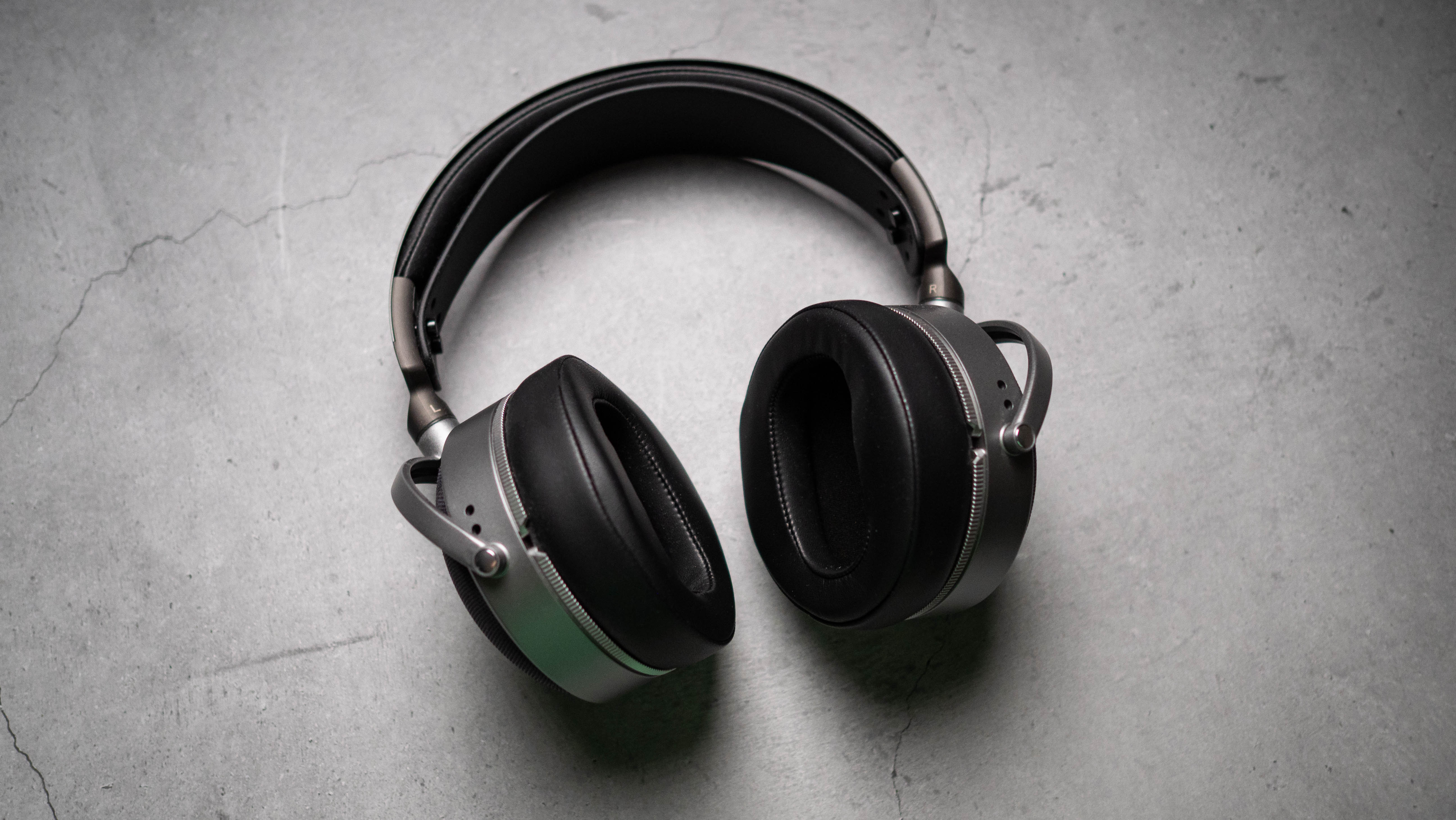 Audeze LCD-S20 planar headset in front of gray kraft sheet highlighting product design