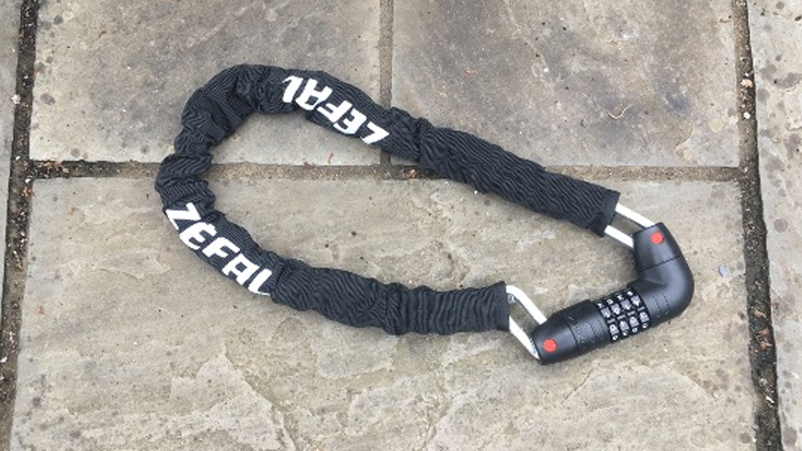 A Zefal K-Traz M12 Code chain lock on paving stones