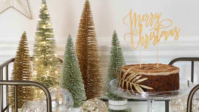 Mini glittered christmas tree display on drinks cart