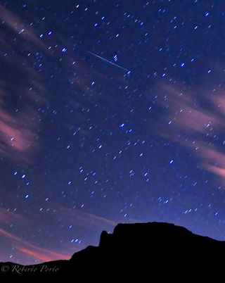 Amateur photographer Roberto Porto snapped this photo of a Quadrantid meteor streaking over Guajara mountain on Tenerife in Spain's Canary Islands on Jan. 4, 2012 during the meteor shower's peak.