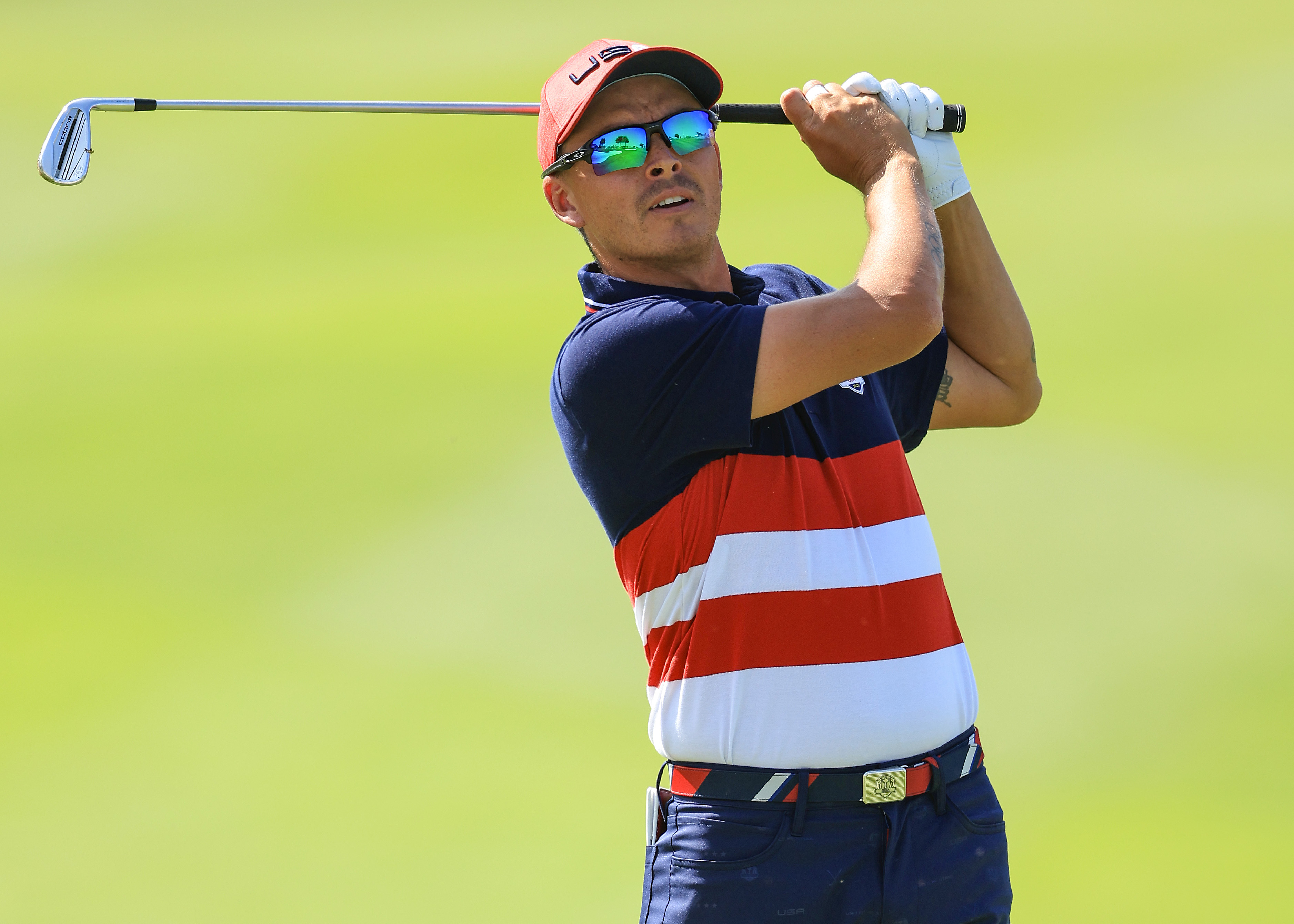 Rickie Fowler hits an iron shot