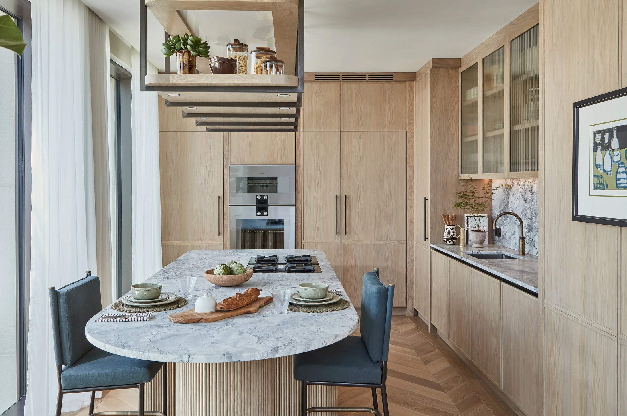 A contemporary kitchen with full-height cabinetry