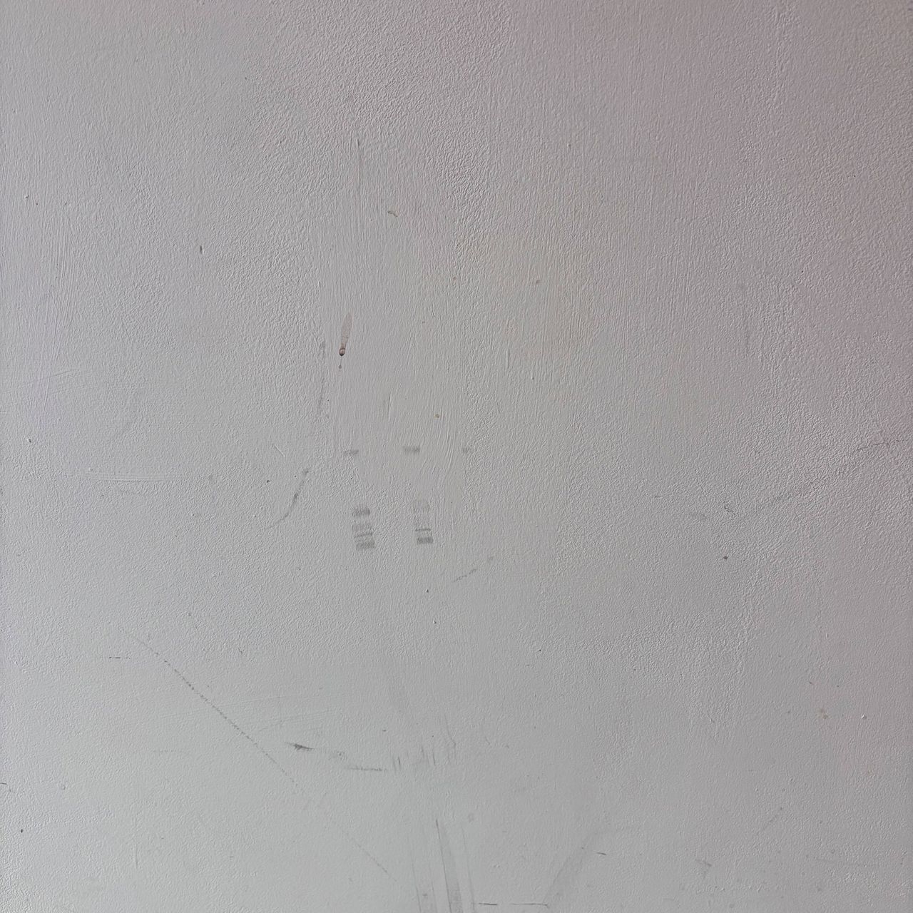 white wall with marks and scuffs
