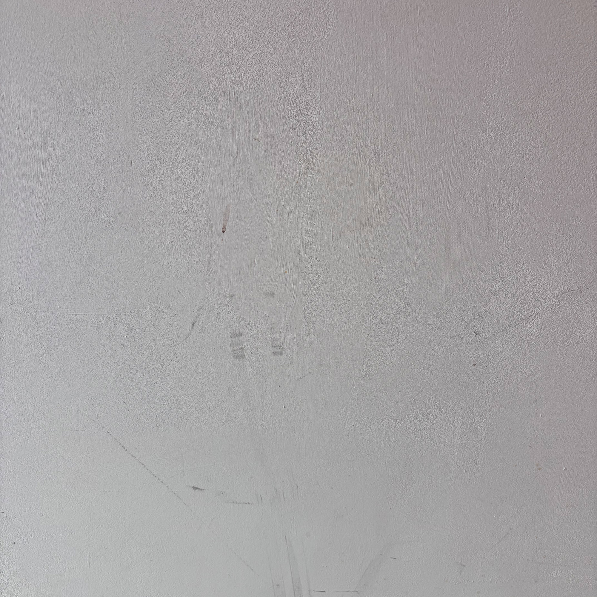 white wall with marks and scuffs