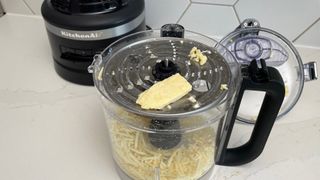 The KitchenAid KFP1319 food processor having just been used to grate cheese