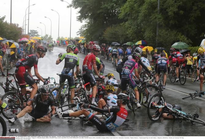 Riders start to pick themselves up after the crash