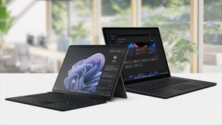 Microsoft Surface devices pictured side by side on a countertop.
