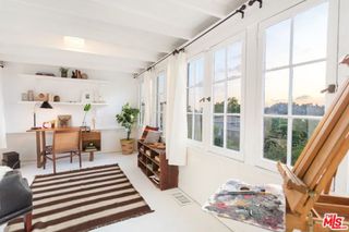 living room with white walls and white windows