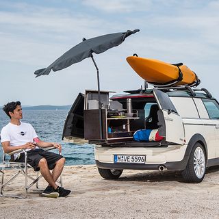 mini camping car and man on beach