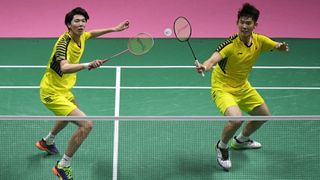Chinese badminton players playing doubles during Thomas Cup