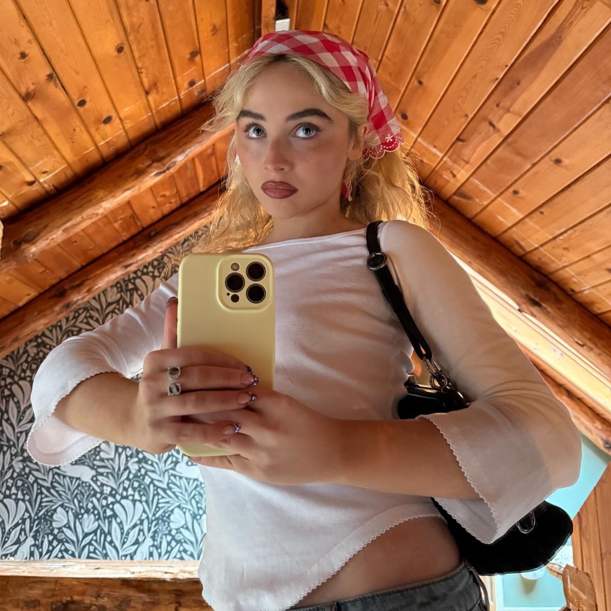 An image of the three-quarter sleeve top trend as seen on Sabrina Carpenter.