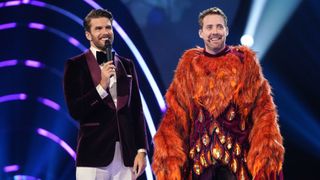 Joel Dommett with Ricky Wilson after being unmasked as Phoenix on The Masked Singer UK season 4