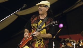 Carlos Santana performs live onstage at the New Orleans Jazz & Heritage Festival in New Orleans, Louisiana on April 24, 1999