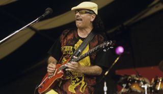 Carlos Santana performs live onstage at the New Orleans Jazz &amp; Heritage Festival in New Orleans, Louisiana on April 24, 1999