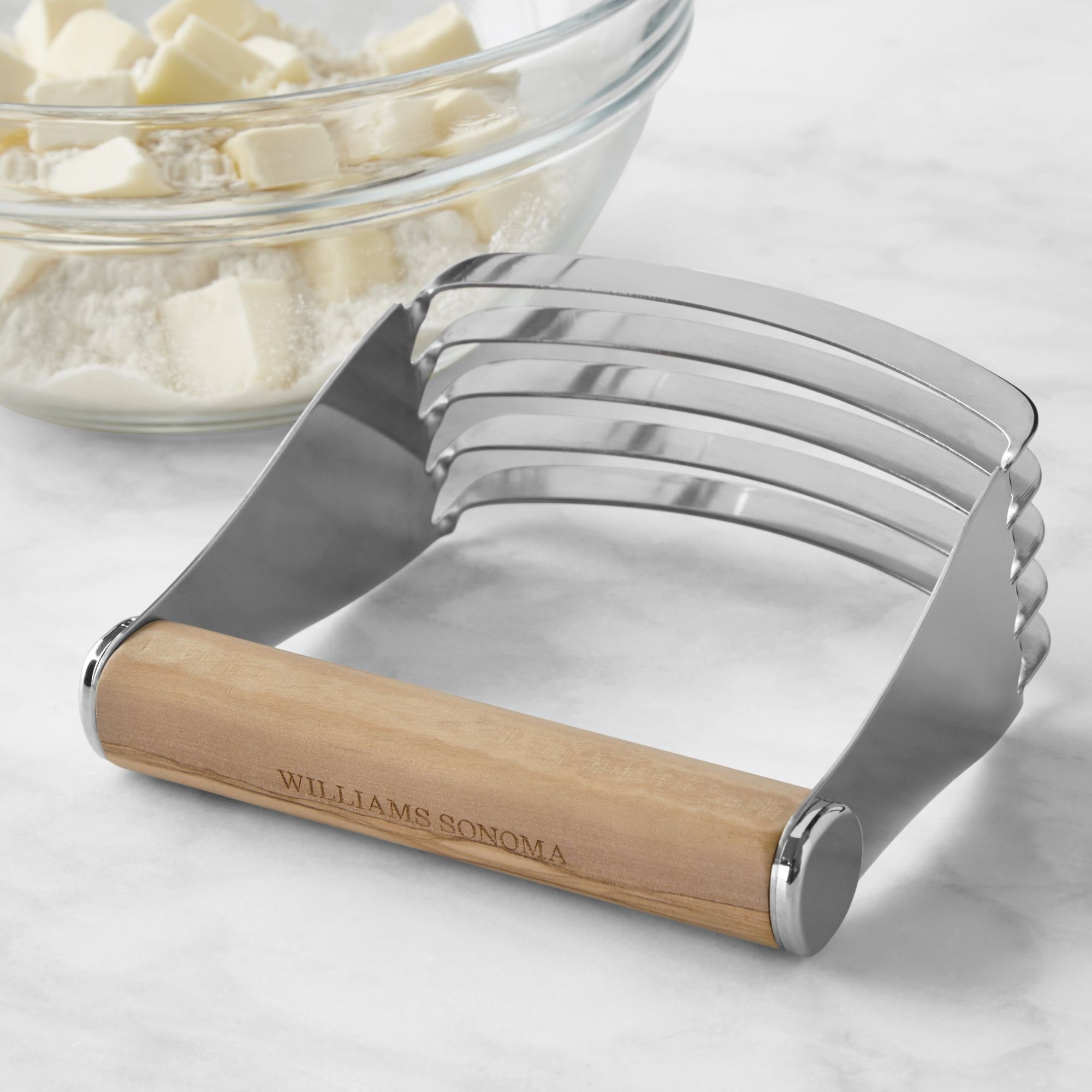 Silver pastry blender with wood handle