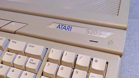 Close up of Atari 520ST microcomputer badge at right hand side of machine.