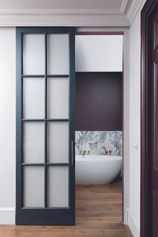 how to use bold color in the bathroom a windowless en suite bathroom with marble tiles and purple walls