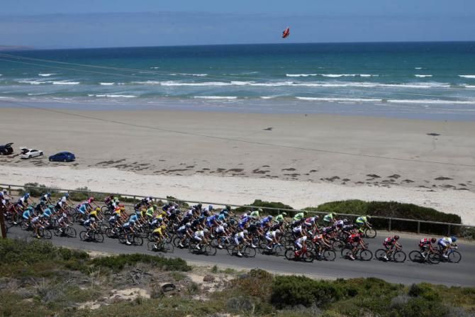 The peloton makes it way past Aldinga Beach
