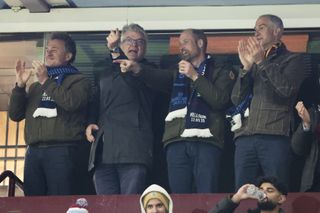 Prince William and three friends attending a March 12, 2025 Aston Villa game clapping and wearing team scarves